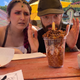 Two people stare at a bbq sundae at a Renaissance Faire.